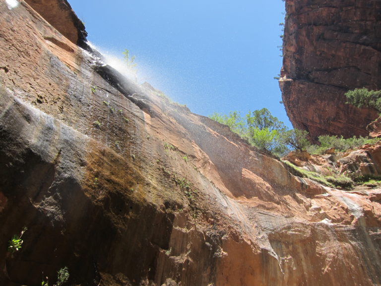 misty water falling from an elevated height on the West Rim Trail in Zion National Park